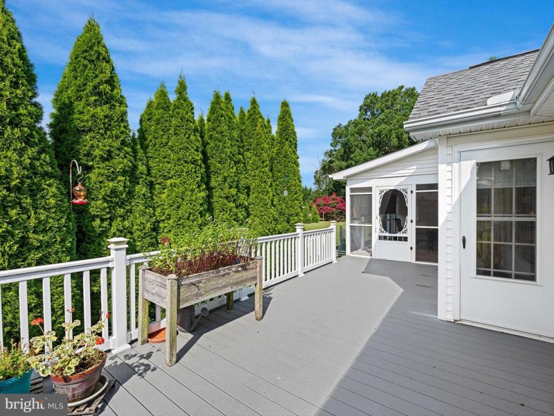 Outside you will find an enclosed screened porch and a deck with new Trex planks and a private backyard perfect for gardening. A new 24x24 pole barn with electricity and heat was just installed and is great for boat storage or a workshop. Boats and RVs are allowed to be stored in the rear of your property. Enjoy the fantastic community dock with a kayak launch, also great for fishing and crabbing. Love Creek feeds directly into the Delaware Bay. Lewes ranch water access pole barn