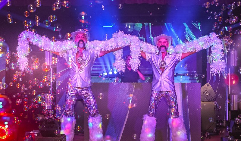 Angelo Ciro, left, and Lon Miller never disappoint with their flamboyant costumes and bubbly personalities at the SunFestival dance. The annual event raises funds for programs at CAMP Rehoboth.