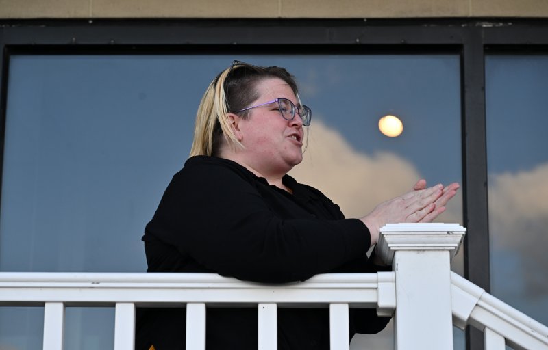 Rehoboth Beach Historical Society and Museum Curator of Collections & Public Engagement Madeline Golden praises the nearly 100 revelers who gathered for Piping Out.