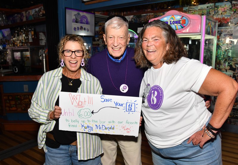 Raising funds at the event are (l-r) Denise Allen, Bill Lee and Kathy McDonald.