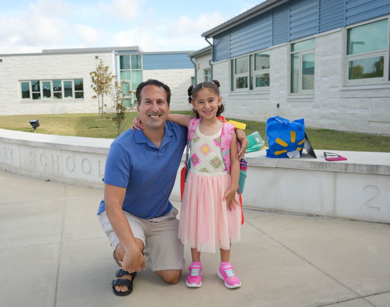 David Moskowitz, left, arrives to Rehoboth Elementary with his daughter, Morgan, a first-grader. ELLEN MCINTYRE PHOTO