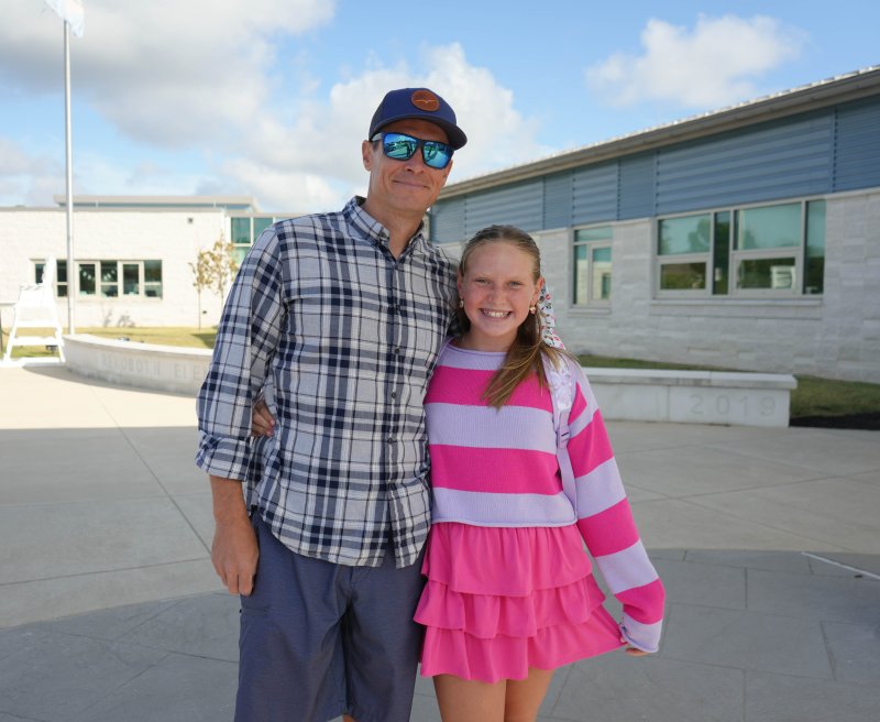 Chris Rausch, left, drops his daughter Caroline off for her first day of fifth grade. ELLEN MCINTYRE PHOTO