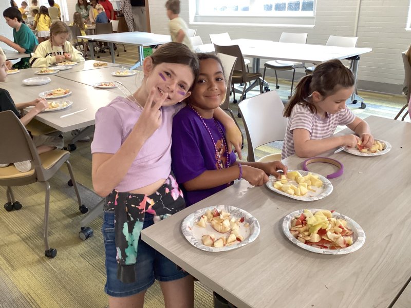 Sporting purple shirts and accessories to share their house spirit are House of Creativity members (l-r) Mia Morris, Ayla Allen-Lopez and Quinn Kass.
