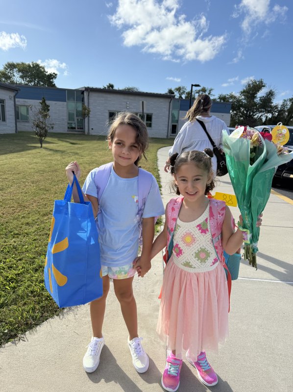 Best friends since they were 4 months old, Makenna Lebron, left, and Morgan Moskowitz walk into Rehoboth Elementary as first graders.