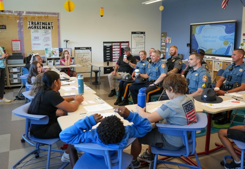Officers from the Delaware State Police and Lewes Police answer students’ questions.