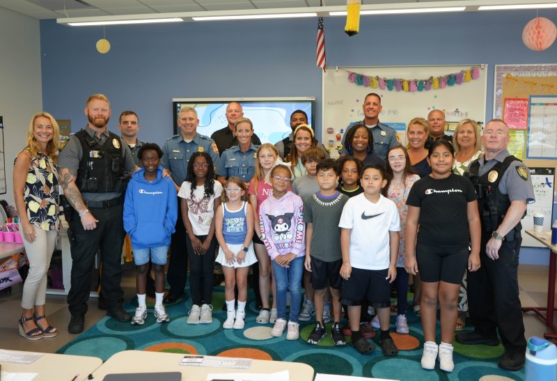 Students in Devon Reber’s third-, fourth- and fifth-grade classes welcome several local police officers into their classroom Sept. 19 for Thank a Police Officer Day. Shown in back are (l-r) Sgt. Nick DeMalto, Constable Mark Nicholas, Officer Isaiah Brown, Senior Cpl. Patrick Jackson and Lt. Jamie Locklear. In middle are Cape Superintendent Jenny Nauman, Cpl. Nick Yatsko, Lt. Dave Hake, Lt. Heather Pepper, teacher Devon Reber, paraeducators Kimberly Hall and Whitney Conte, Assistant Superintendent LouAnn Hudson and Cpl. Rick Schiazza. In front are students Sh’Amire Bowe, Ja’Onna Hall, Lola Georgules, Claire Dacheux, Karmella Henry, Marshall Doughty, Joseph Velasquez-Ortiz, Drayden Vann, Timothy Buckmaster, Anna Wilson and Karla Ortiz-Hernandez. ELLEN MCINTYRE PHOTOS