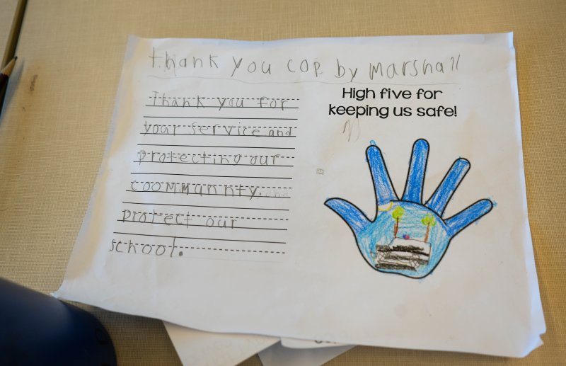 Student Marshall Doughty thanks the officers for their service and dedication to protecting the community.