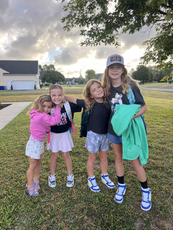 Kids’ Cottage pre-kindergartener Rowen Pentoney, along with Milton Elementary School students Ellie Pentoney, Finley Pentoney and Harlow Pentoney get ready to head back to class.
