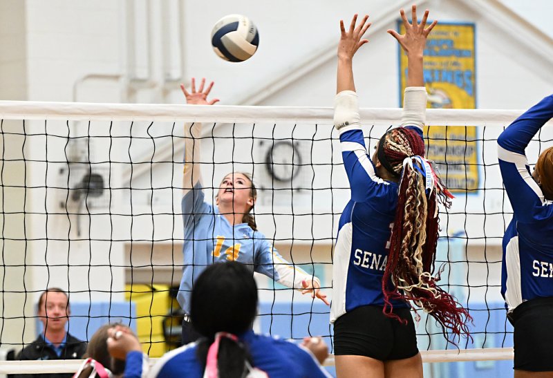 Senior Rylee Ockels pounds a kill.
