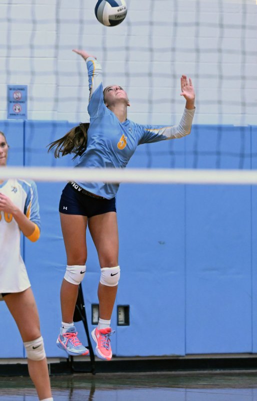 Cape junior Camilla Willis serves a winner.