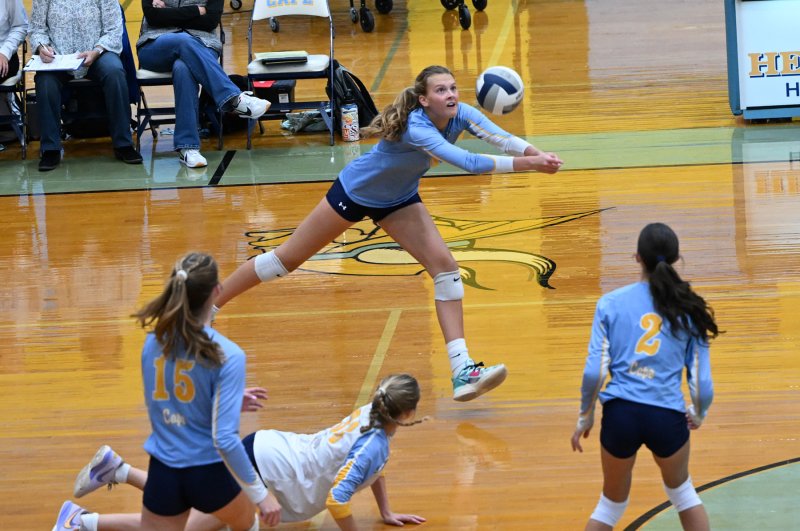 Junior Harper Mamele makes a point-saving dig.