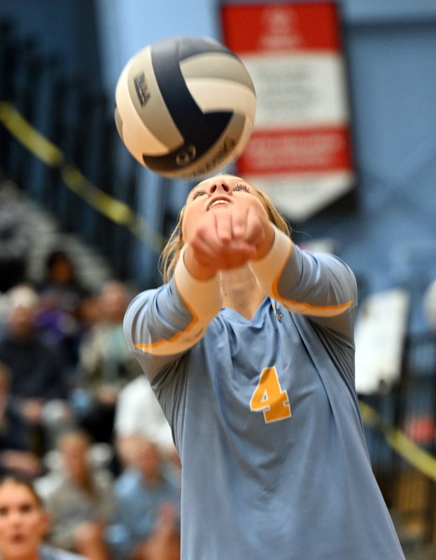 Junior Harper Mamele bumps a set.