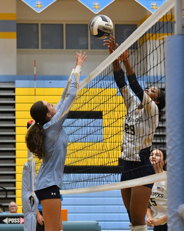 Cape senior setter Kaylee Sockriter goes for a joust with DMA’s Nissi	Wadieh.