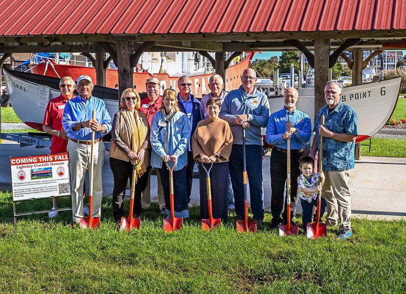 Attending the groundbreaking of the museum support building Oct. 4 are (l-r) Roger Kennedy, Overfalls Foundation President Dave Shook, Lewes Mayor Amy Marasco, volunteer Bob Murphy, Lewes Chamber of Commerce Executive Director Betsy Reamer, board member Ted Hack, Sussex County Councilwoman Jane Gruenebaum, volunteer Dave Bernheisel, Lewes Sen. Russ Huxtable, Overfalls Past President Mike Safina and Lewes Councilman Joe Elder with his grandson Leon. DAN COOK PHOTO