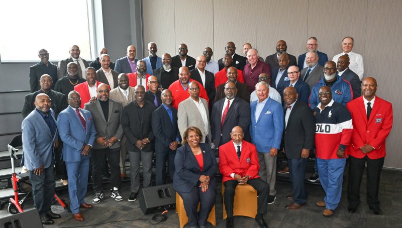 The 1985 Delaware State University football team poses for a picture at the 40th anniversary event. Shown in back are (l-r) Mark Ware, Darren Felton, Roger Johnson, Marcelus Edwards, Sam Williams, David Crocker, Mike Cherry, Jack Downs, Desmond Wynn, Franz Kappel and John Coveleski. In third row are Pat Casey, Gerald Cordova, Elridge Comer, PJ Lee, Everett Morgan, Willie Sheppard, James Thorton, Mat Horace, Ron Allen and Greg Mclaurin. In second row are Ralph Kemmerlin, John Ridgeway, Dr. Tony Allen, Dr. Marvin Bright, Cordie Greenlea, Gene Lake, Arlington Morgan, Dave Dolch and Robert Presbury. In front are Chad Robinson, Greg Scudder, John Barber, Reggie Barnes, Curtis Trott, Dwayne Henry, Robert Maull, former coach Joe Purzycki, head coach Bill Collick, Tim Gray and Mark Sills. Sitting are former DSU President Wilma Mishoe and 60-year equipment manager Arthur Wright. DAN COOK PHOTOS