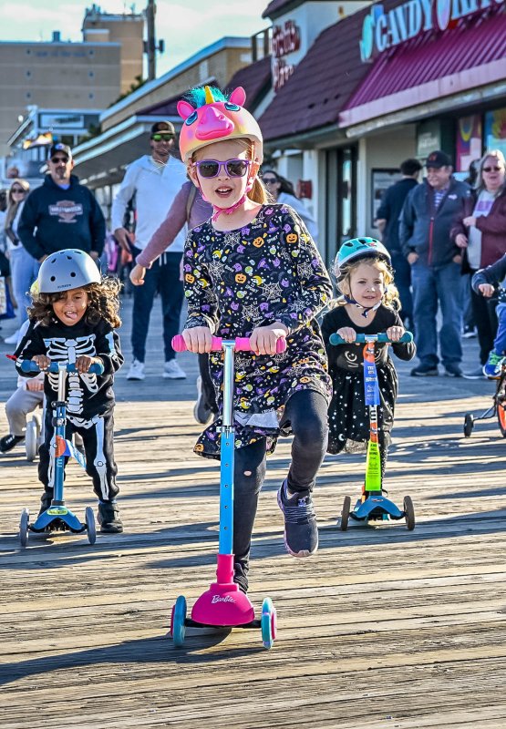 Charlotte Hanslovan, 6, leads the pack on her scooter in the second heat of the Tyke Bike event. DAN COOK PHOTO