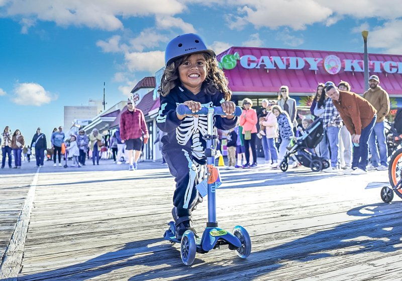 Teddy McGinty, 3, rolls the tyke race on his scooter. DAN COOK PHOTO