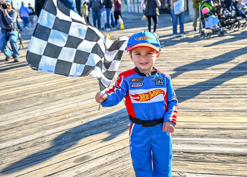 Taking the checkered flag with his hot wheels group is Drew Rumberger, 3. DAN COOK PHOTO