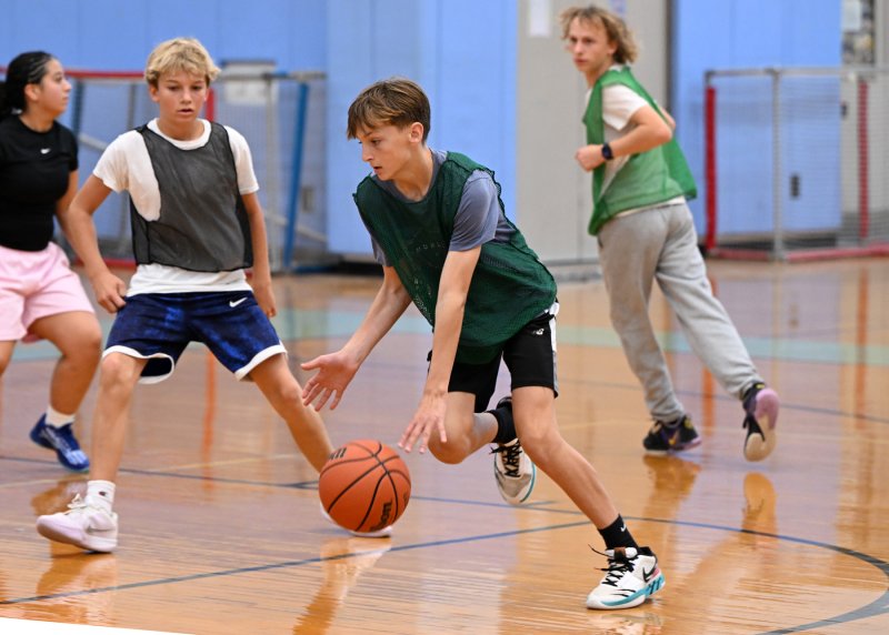 Camper Jonah Hewitt drives on James Frederick during a scrimmage.