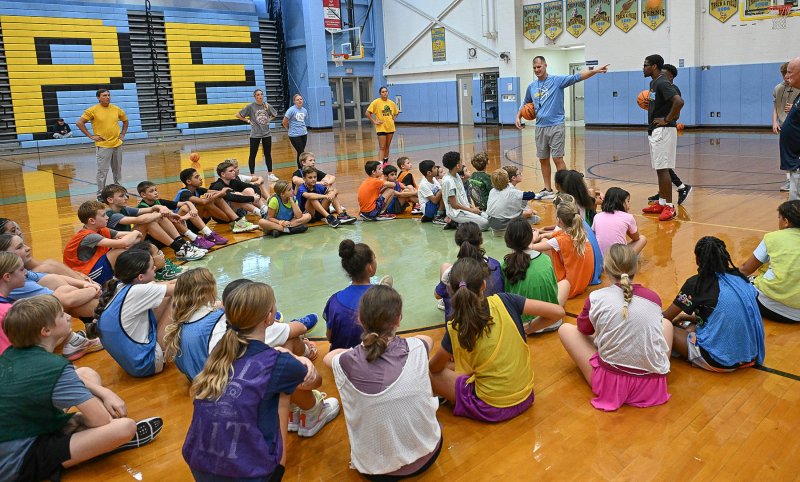 Cape coach and camp director Steve Re reviews the skills taught during a break.
