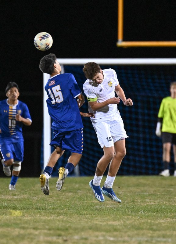 Cape senior Lee Levis heads the ball away from Central’s Carlos Gutierrez-Carcamo.