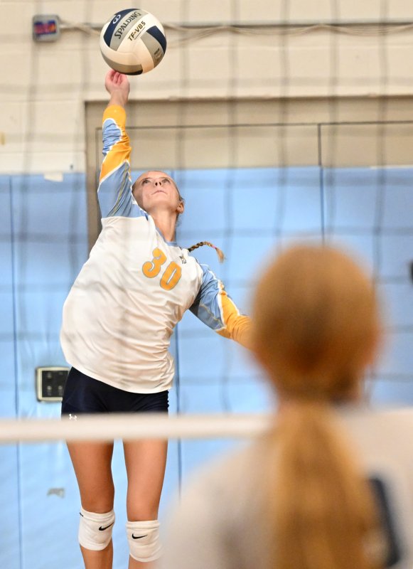 Cape libero Amara Fruchtman slams a serve.