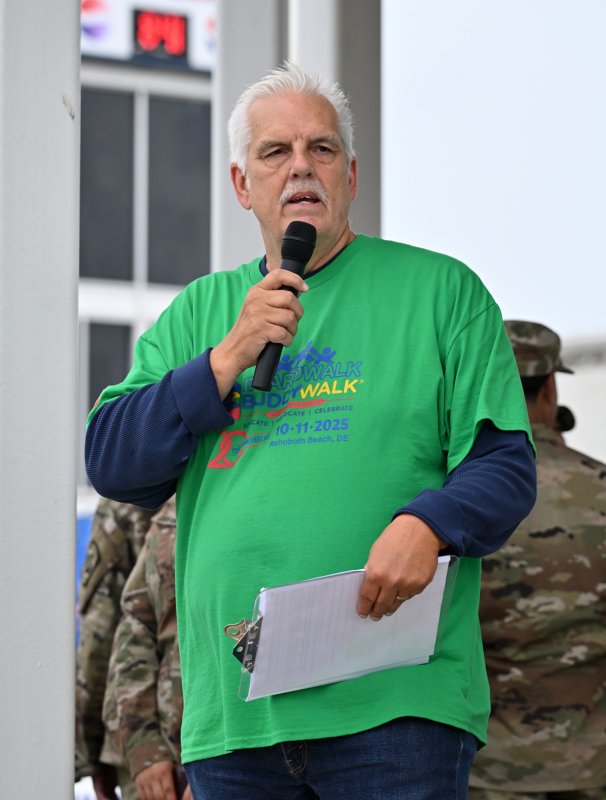 Jim Watson, executive director for the Boardwalk Buddy Walk, welcomes walkers and visitors to the 20th annual Buddy Walk.