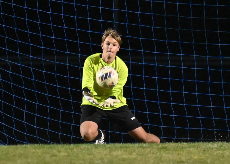 Junior Anton Schierenberg makes a save for the Vikings.