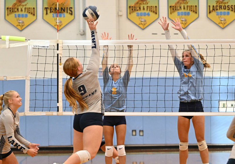 Lake’s Bayli Glanden tries to pound a shot between Cape’s Kaylee Sockriter and Amalia Fruchtman.