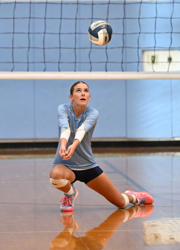 Cape junior Camilla Willis bumps a return.