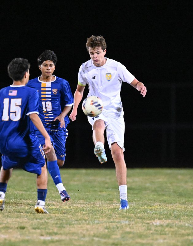 Lee Levis clears the ball for the Vikings.