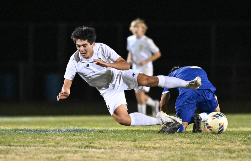 Will Burke gets fouled by a Central defender.