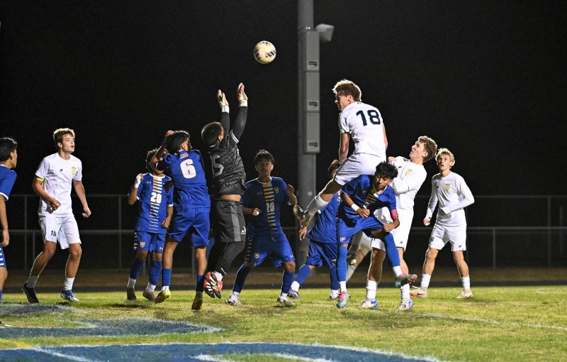 Cape senior Lawson Whaley heads in the winning goal off a throw in by Brenner Short.
