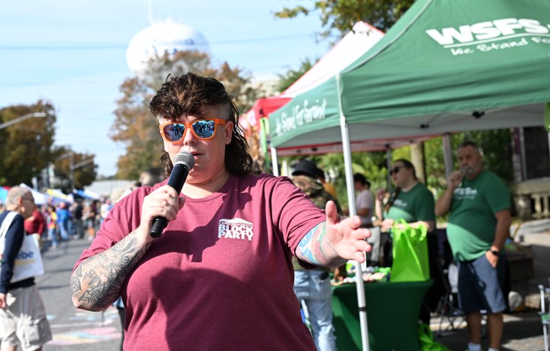 CAMP board member Michelle Manfredi acts as emcee for the event.