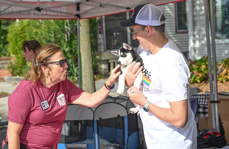 CAMP staff member Laurie Thompson is gaga over Artemus with Jim Schmidt from the Brandywine Valley SPCA.