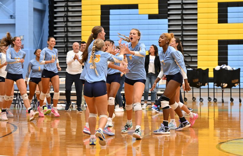The Cape squad gets excited after coming back and winning the second set. DAN COOK PHOTOS