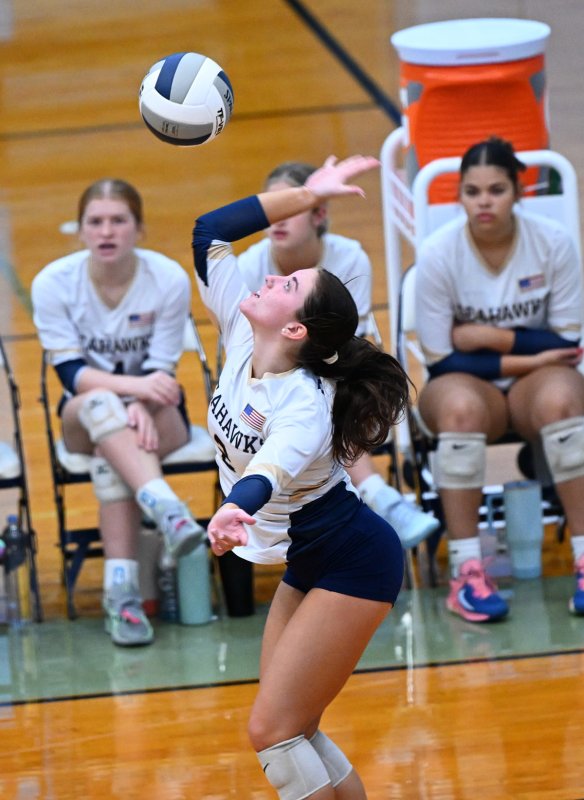 DMA senior Brianna Hathaway pounds a winner.