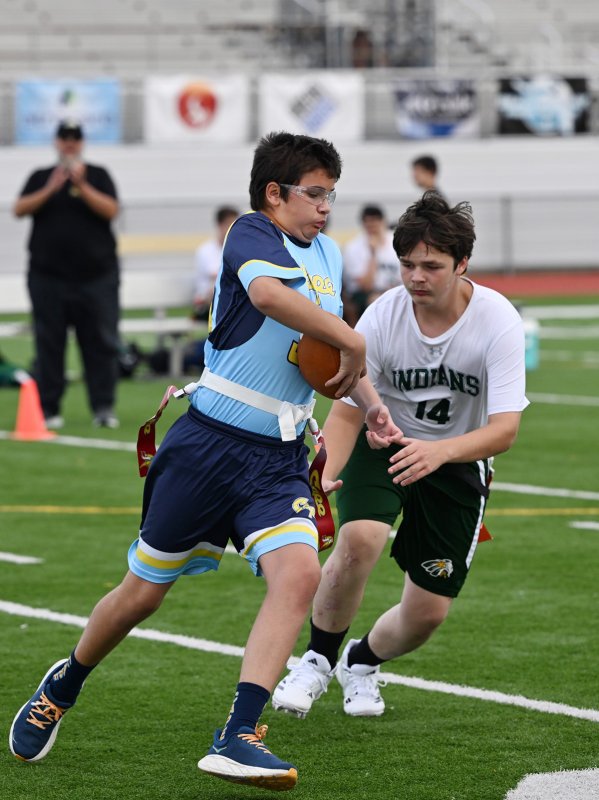 Julian Puente runs past IR’s Landon Steininger and scores for the Vikings.