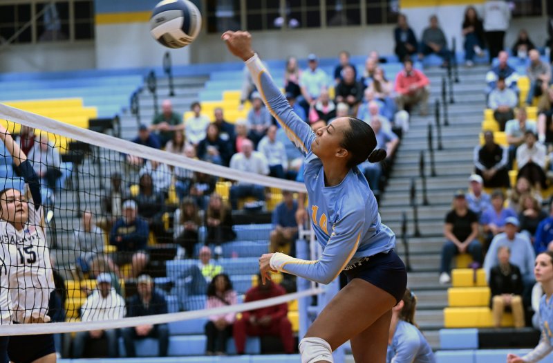 Cape sophomore Journey McDaniel knocks down a kill.