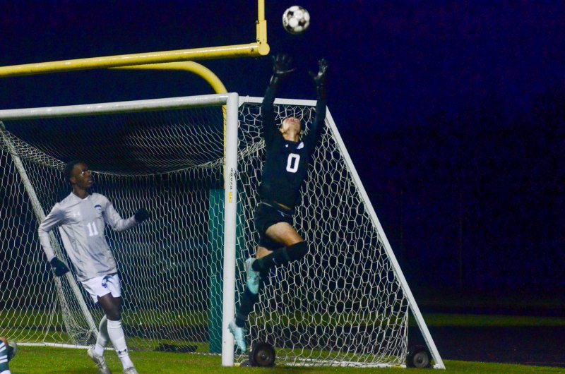 Seahawks senior Austin Taylor flies up to grab the ball.