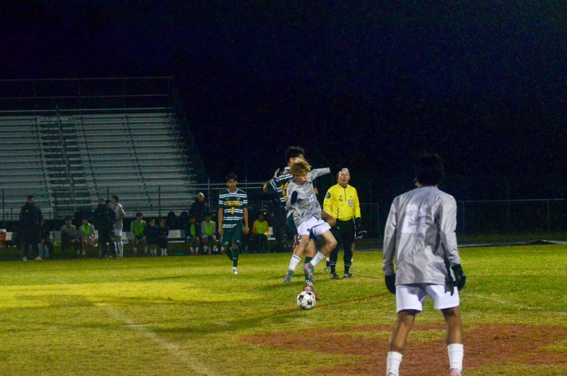 Sussex Academy eighth-grader Nico Haskell fights for the ball.