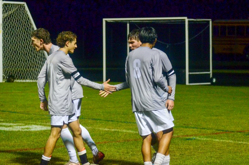 Sussex Academy senior Ruendi Ortiz-Santos watches his classmate Chase Ballinger let out a war cry while Liam Stegall, left, shakes hands with George Sapna after the third goal.
