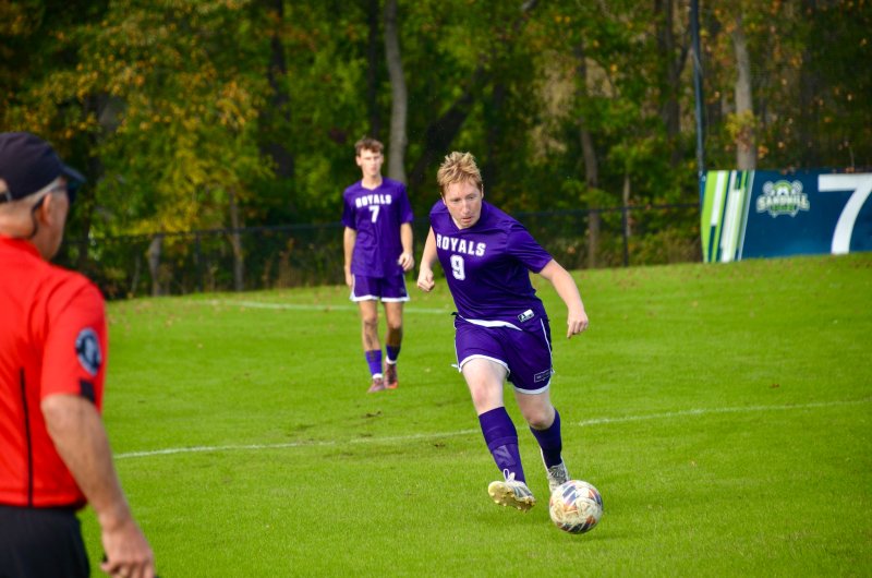 Royals senior Josh Strawhecker passes the ball.