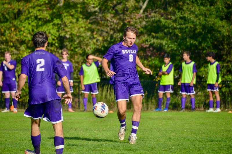 Royals junior Matthew Heacock passes the ball.