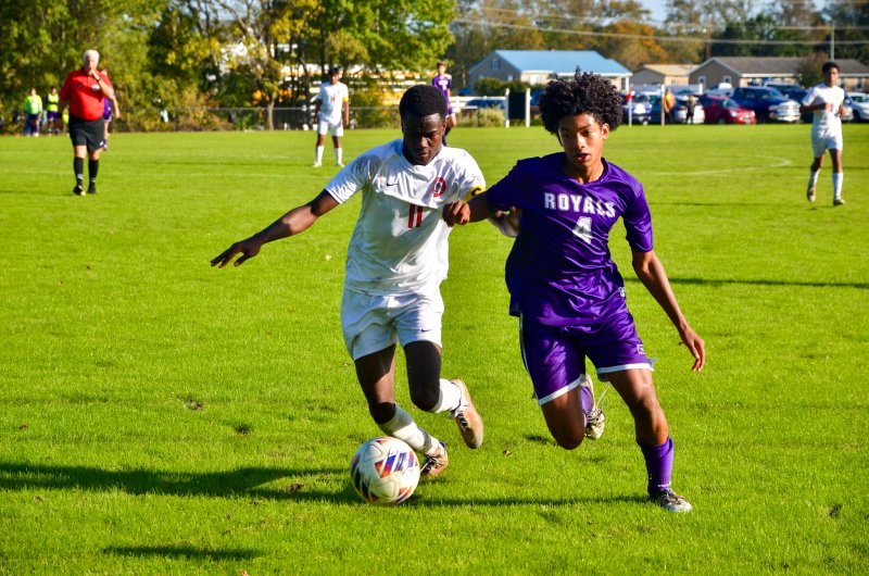 Royals sophomore Blake Dale battles for the ball along the sideline.