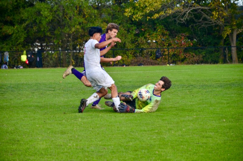 Royals junior Isaiah McCluskey makes one of his impressive saves late in the game.