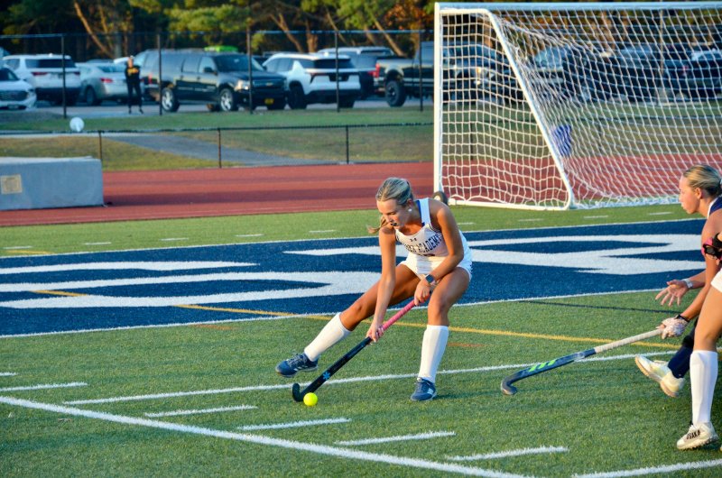 Sussex Academy junior Bailey Mears controls the ball on the sideline.