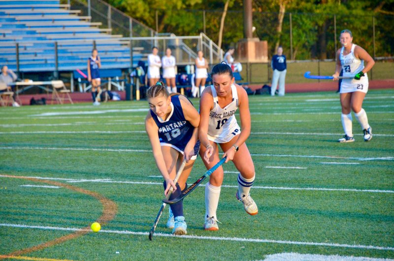 Seahawks senior Shea Danahy battles with Lake Forest senior Hanna Wood.