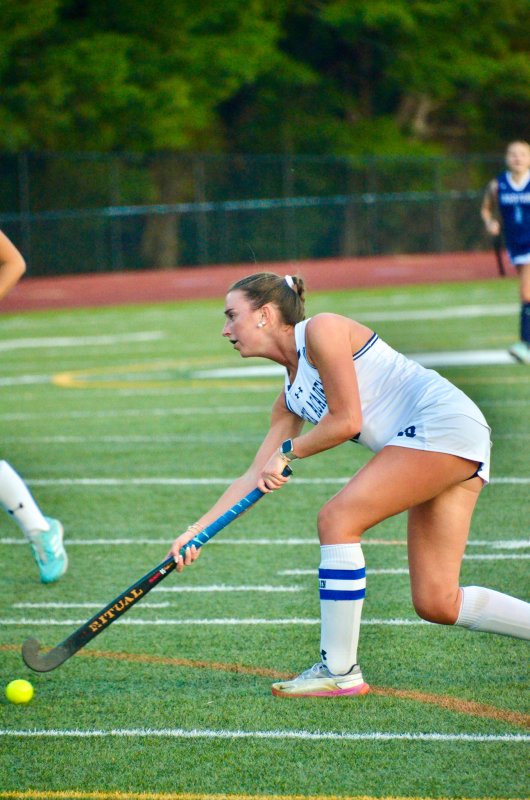 Sussex Academy senior Shea Danahy passes the ball on a corner.