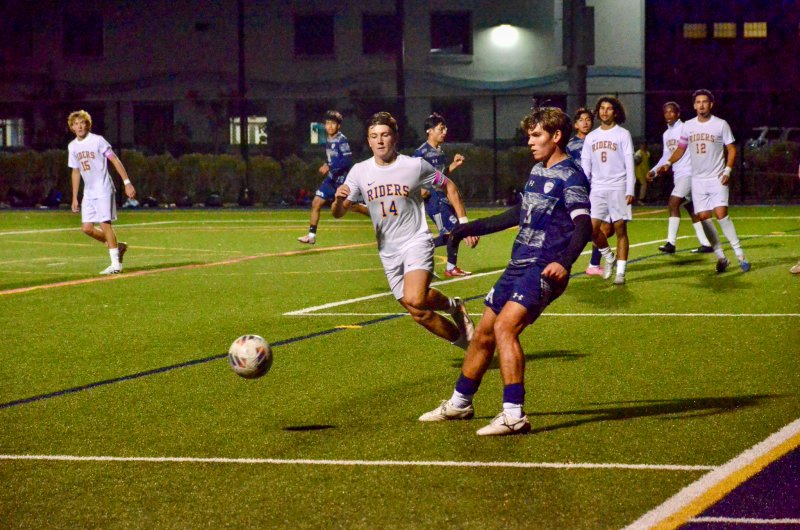 Sussex Academy senior George Sapna passes the ball in the corner.